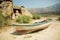 Rural landscape with old fishing boat on the dry land of beach, lake Bafa, rural Turkey.