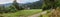 Rural landscape, panorama, banner - view on of the wooden historical reconstruction in vicinity of the Tustan medieval fortress