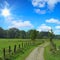 Rural landscape with path through the meadows