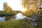 Rural landscape. Pond trees birches garden, old wooden arbor bench table, sunset autumn