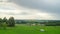 Rural landscape with rain clouds and grazing sheep, time-lapse