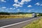 Rural landscape with road you are driving a white truck