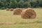 Rural landscape with rolls of straw stacks