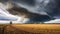 Rural landscape with stormy clouds in the sky over the field