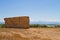 Rural landscape with strawbales and mountains