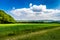 Rural Landscape With Sunlit Clouds In Front Of The Skyline Of Vienna In Austria