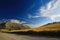 Rural landscape under dramatic sky cloud formations in the high plains of Sierra Nevada