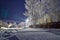 Rural landscape in winter with snow-covered trees. Twilight of a winter night and the magic of a snowy nature