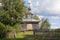 Rural landscape with wooden chapel
