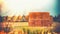 Rural late summer country landscape with wheat haystack or straw bales on field, agriculture farm