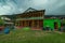 Rural life in himalayas - a himachali traditional house in sainj valley in front of Himalayas