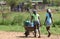 Rural living - village girls carting water home