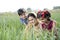 Rural mother with children in agricultural field