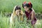 Rural mother with daughter in agricultural field