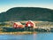 Rural Norwegian landscape, traditional red and white wooden house