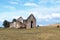 Rural Old Derelect Farm Building on Dry Winter Landscape