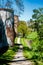 Rural path leading past two circular brick towers