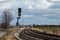 Rural railroad tracks, no catenary, with signaling system