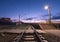 Rural railway station at night with blue sky. Railroad