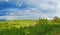 Rural rainbow landscape, view of green meadows and hills