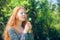 Rural red-haired girl with a dandelion