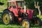 Rural red old farm tractor outdoor