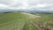 Rural road among the hills. Cloudy day. Nature walk. Peace and quiet