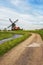 A Rural road and windmill in Netherlands