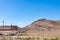 Rural Rocky Landscape with Partially Built House and Hills in Morocco