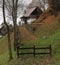 Rural romantic house with wooden roof  in autumn colourful  countryside