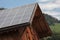 Rural scene of an alpine barn with photovoltaic panels
