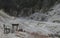 Rural scene with the dry riverbed so many stones and a table wit