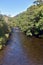 Rural scene of the Dwyfor river, north Wales, flowing through the charming Welsh village of Llanystumdwy.