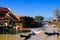 Rural scenery on river with boats and stilt houses