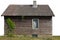 Rural shed with one window and wild grapes