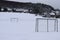 rural soccer field in snow near village Engeln