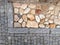 Rural stone paving urban square made of quartz cobbles size about 15cm joints filled with gravel brown beige white yellow color