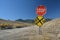 Rural Stop Sign and Dirt Road Railroad Crossing in the Mountains