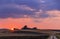 Rural summer lanscape. Between Apulia and Basilicata: farmhouse at sunset after the harvest.Italy