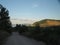 Rural traffic road in a wooded hilly area. Summer.