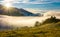 Rural valley at foggy sunrise in autumn