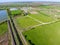 Rural . View from above. On the horizon there is a poultry farm, a field, forest belts and a river