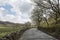 Rural winding road surrounded by hills