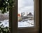 Rural winter landscape outside the window, snowfall, snowdrifts