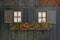 Rural wooden facade with windows and flowers in alps town Rhemes Notre Dame