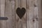 Rural wooden toilet, heart on the board