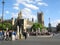 At rush hour pedestrians cross the Bridge Street on crosswalk near the Westminster Palace Houses of Parliament in London, UK .