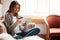 Less rush, more relaxing retail therapy. an attractive young woman using a digital tablet and credit card on the sofa at