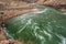 The Rushing Colorado River Passing Under The Silver Bridge