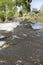 Rushing river rapids smooth flow over rocks with reflections